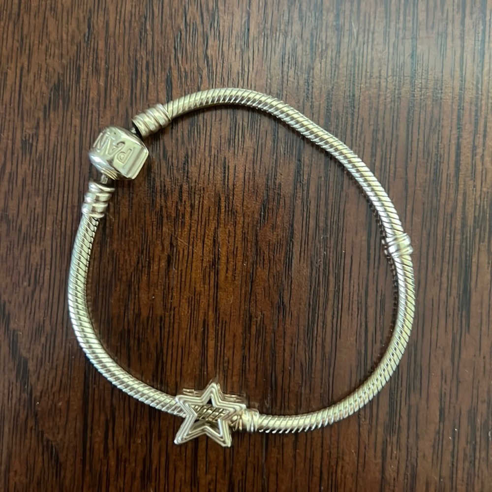 Pandora 14K gold bracelet with barrel clasp. 14k gold star charm.